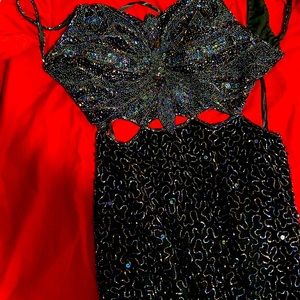 90s Donatello slim fit beaded dress with open back and two thigh slits.